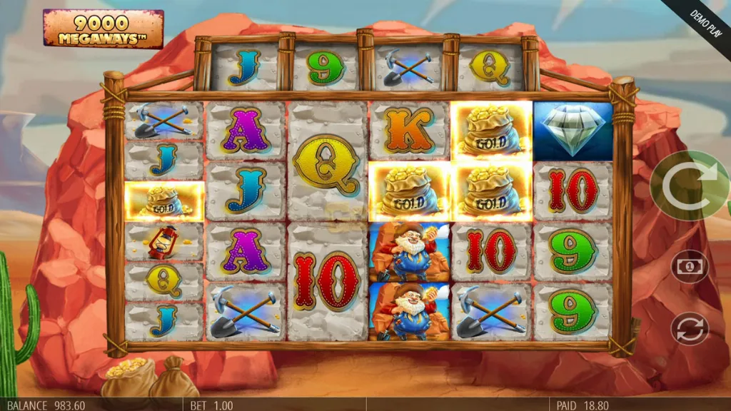 Screenshot of Diamond Mine Megaways triggering a bonus. The reels display gold bag symbols and diamonds, with highlighted gold bags on multiple reels. The interface shows a balance of 983.60 and a bet of 1.00.