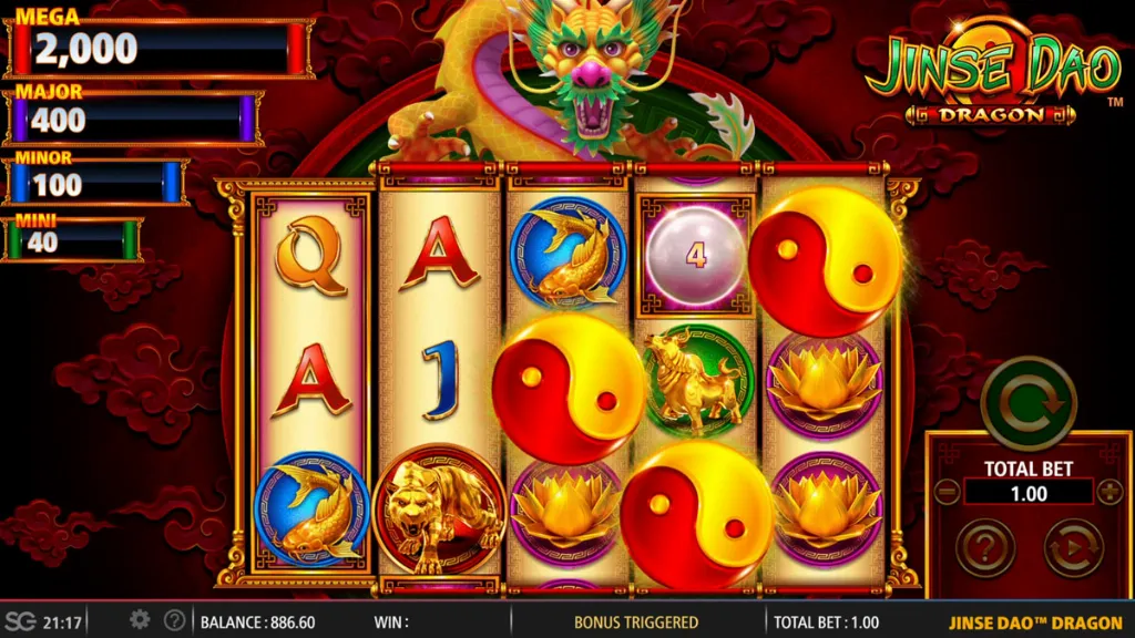 The game Jinse Dao Dragon displays glowing yin-yang symbols, golden animals, and a dragon backdrop as the bonus feature is triggered.