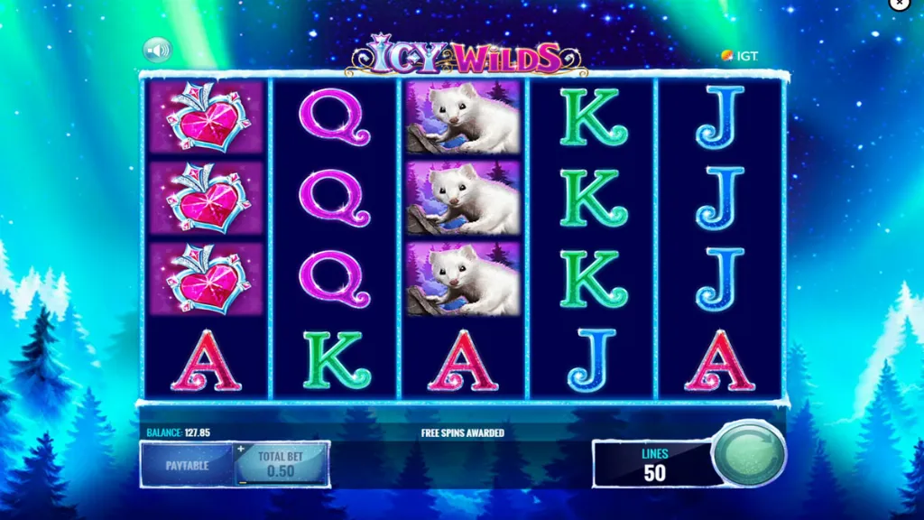 Icy Wilds slot free spins round featuring gem hearts, snow animals, and card symbols against a frozen forest background.