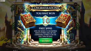 Book of Camelot Free Spins Quest trigger screen awarding 10 free spins and selecting an expanding symbol.